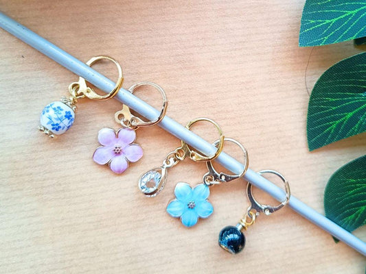 Stitch marker set with flowers and beads for knitting and crochet projects.