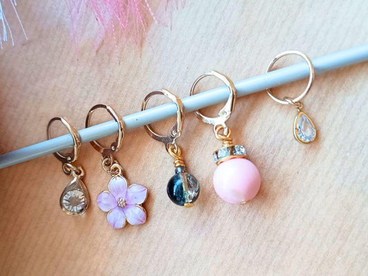 Stitch marker set with pendants and beads for knitting and crochet projects.