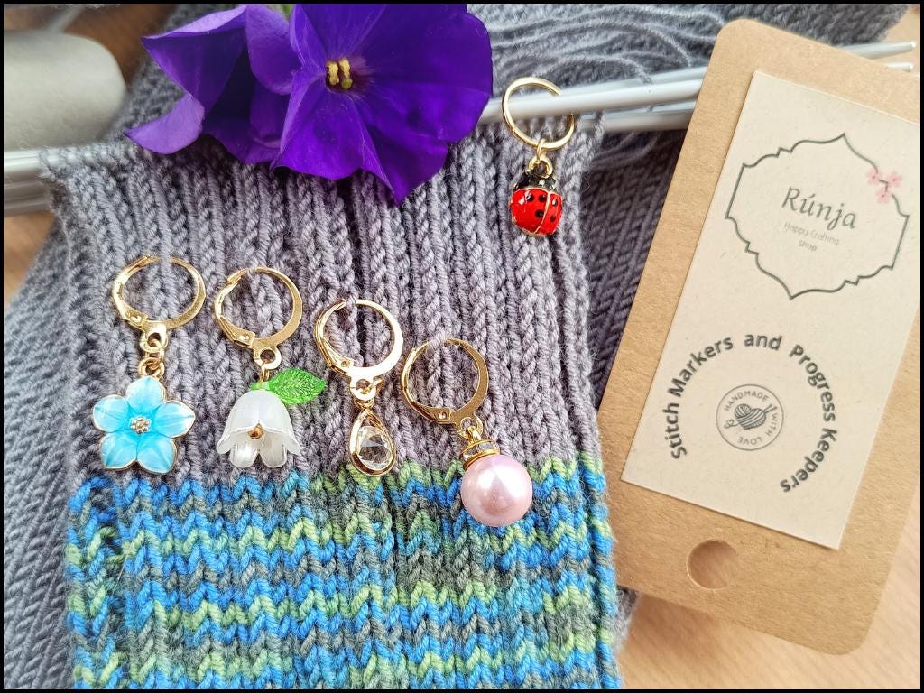 Stitch marker set with flowers, ladybug, pearl and drop pendant for knitting and crochet projects. 