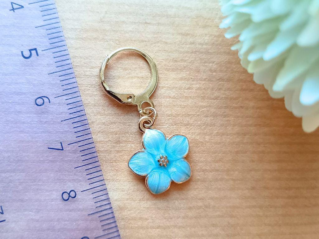 Stitch marker set with pendants and beads for knitting and crochet projects.