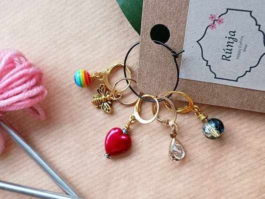 Stitch marker set of 5 with pendants and beads for knitting and crochet projects.