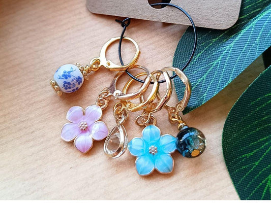 Stitch marker set with flowers and beads for knitting and crochet projects.