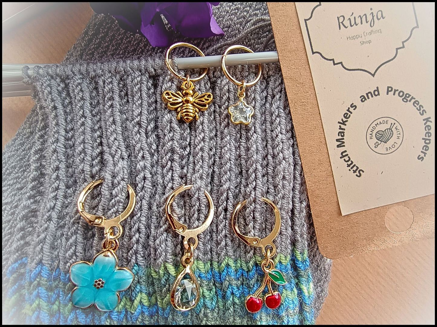 Stitch marker set with cherry, bee, star and flower for knitting and crochet projects. 
