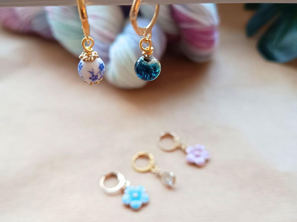 Stitch marker set with flowers and beads for knitting and crochet projects.