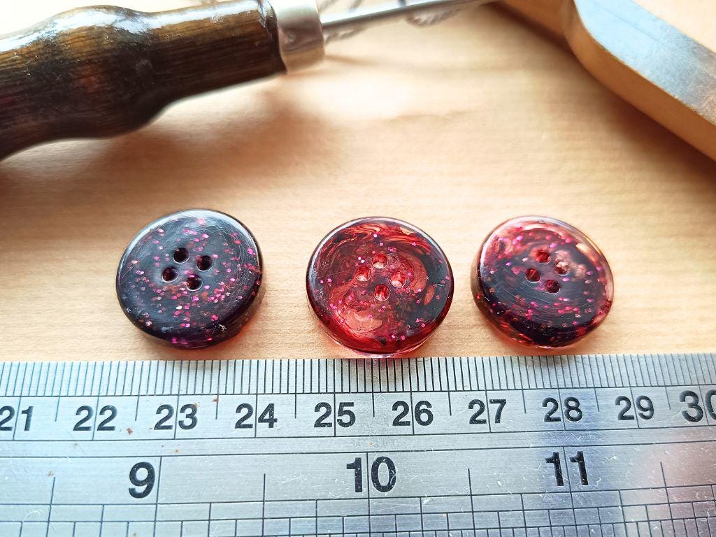 Handmade buttons for sewing, knitting or crocheting projects. Set of 5 buttons. Approx. 20 mm in diameter. Dark brown with pink glitter. Resin