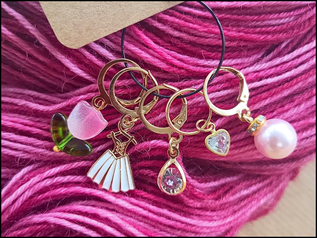 Stitch marker set with flowers, dress, pearl and drop pendant for knitting and crochet projects. 
