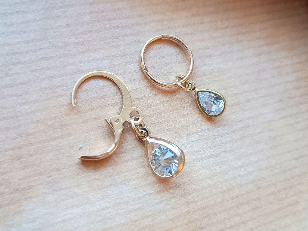 Stitch marker set with pendants and beads for knitting and crochet projects.