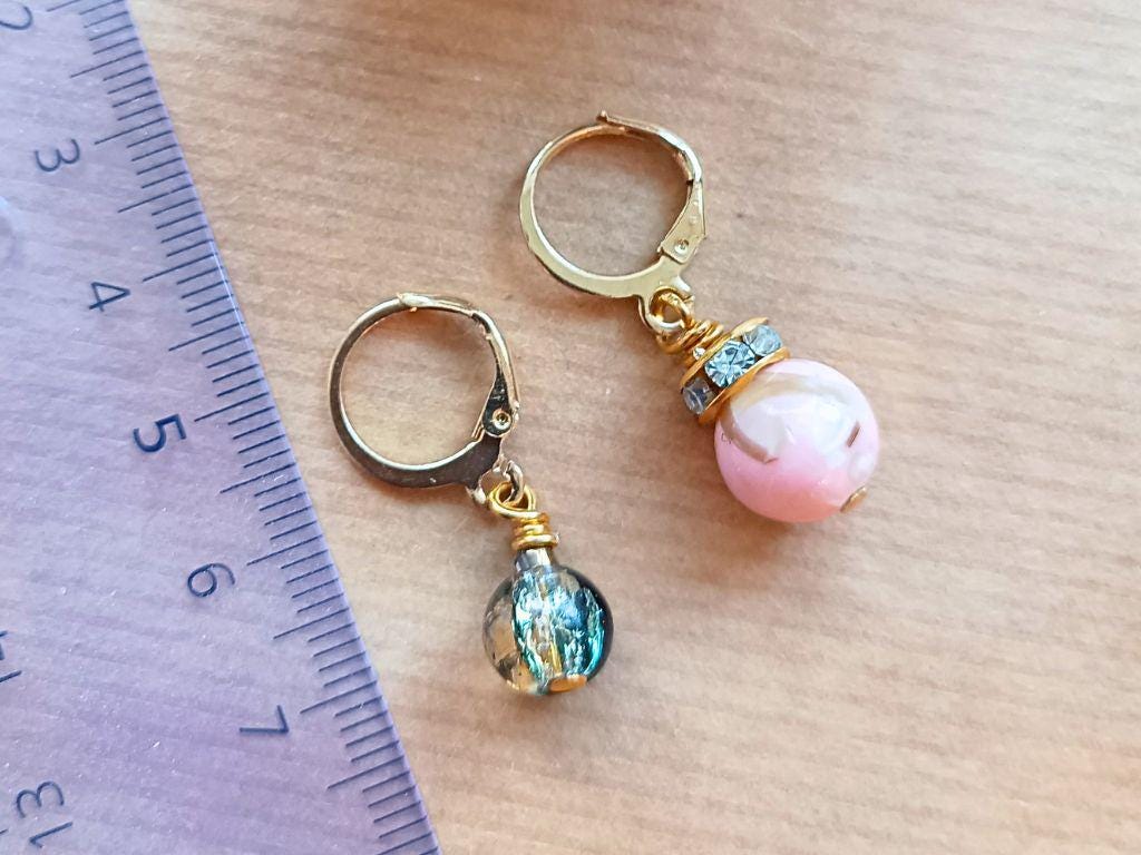 Stitch marker set with pendants and beads for knitting and crochet projects.