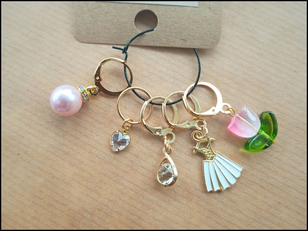 Stitch marker set with flowers, dress, pearl and drop pendant for knitting and crochet projects. 